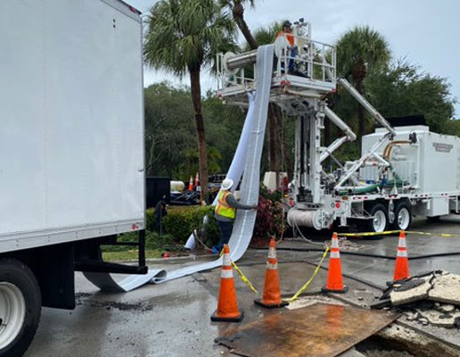 Shenandoah worker in a lift - Cured-In-Place Pipe Lining