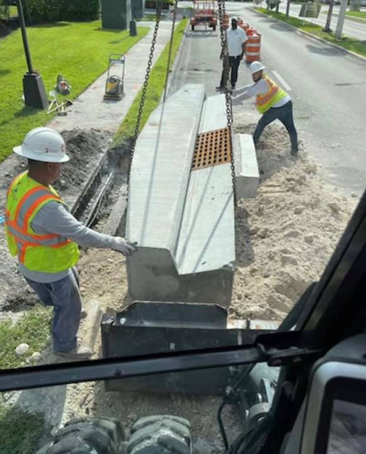 Shenandoah workers in a ditch - Specialty Services& Drainage Enhancements