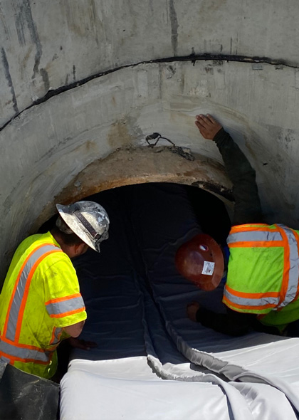 Shenandoah workers inspecting pipes - Stormwater and Sanitary System Cleaning