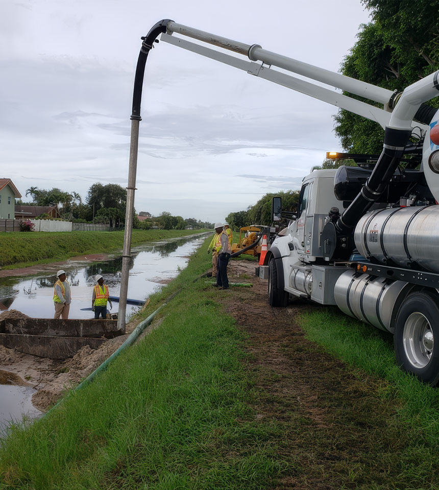 Shenandoah workers inspecting pipes - Hydro Excavation Services